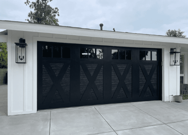 Stylish black garage door enhancing California home curb appeal and value.