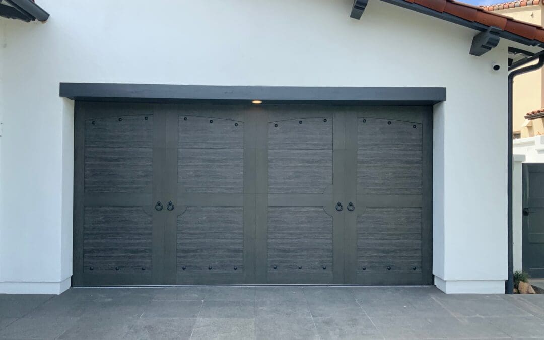 Clopay Canyon Ridge garage door in Slate Mahogany finish with decorative hardware boosting Porter Ranch home value