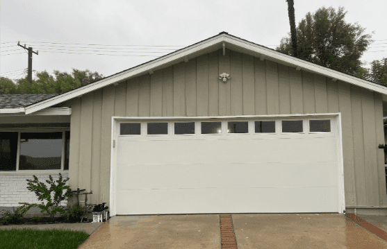 Garage doors in Thousand Oaks, California, with window panels and insulated steel design.
