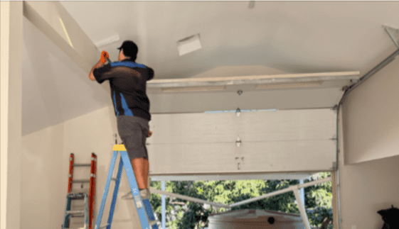 Archway Garage Doors technician repairing garage door in Tarzana, California.