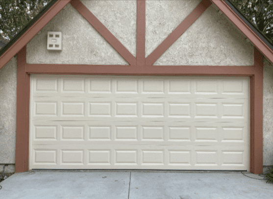 White garage door in Saugus, California, illustrating affordable garage door repair services.