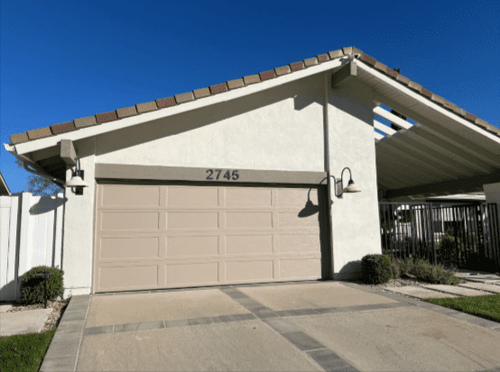 Stevenson Ranch home with closed garage door and Archway Garage Doors lighting.