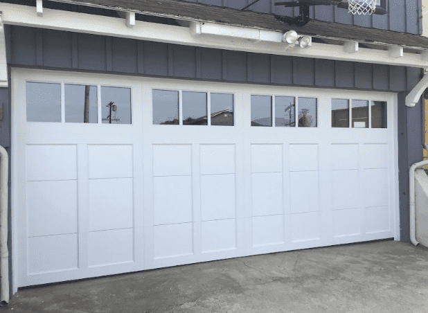 White garage door with windows illustrating automatic garage door repair in Tarzana.